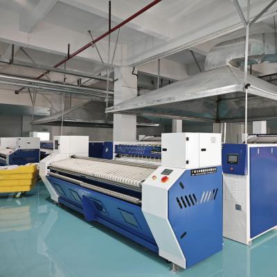 工業(yè)洗滌高峰季產能提升方案 - 廣屹智能送布機實戰(zhàn)案例解析